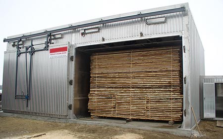 Use of steam coils in a wood dryer